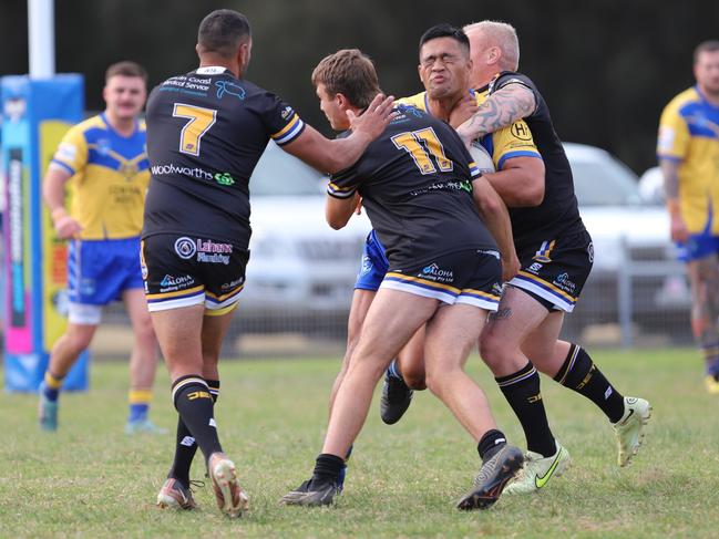 Gorillas forward Caleb Tohovaka runs hard at Thomas Latta (number 11). Picture: Steve Montgomery/Ourfootyteam