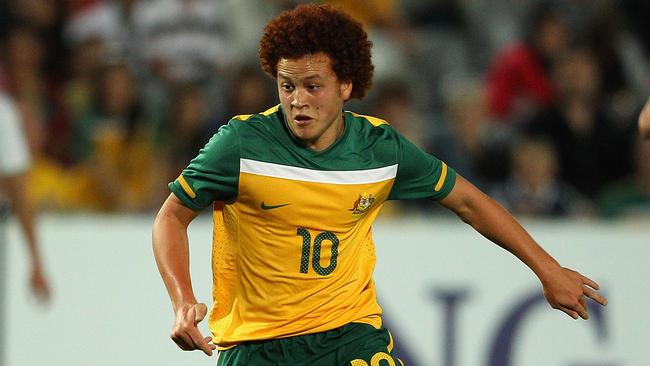 GOSFORD, AUSTRALIA - MARCH 14: Mustafa Amini of Australia dribbles the ball during the third round 2012 Olympic Games Asian Qualifier match between Australia and Iraq at Bluetongue Stadium on March 14, 2012 in Gosford, Australia. (Photo by Cameron Spencer/Getty Images)