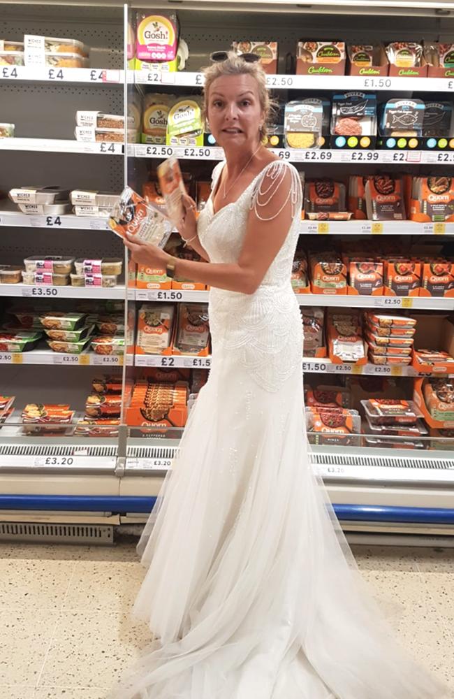 From food shopping to cleaning, cooking and paddle boarding, Dawn has certainly made the most out of her gown. Picture: Caters News.