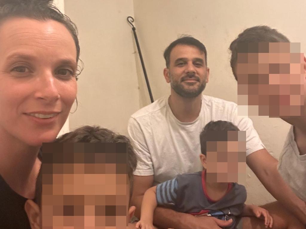 Emily Gian, 41, with her husband Tomer and their three children in their bomb shelter in Israel. Supplied