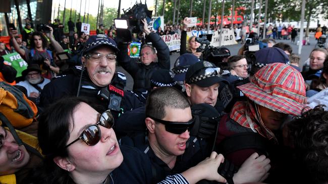 Protesters clash with police outside the three-day International Mining and Resources Conference which starts on Tuesday.