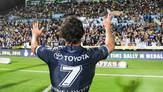 Johnathan Thurston waves to Cowboys fans after playing his last home game. Picture: AAP