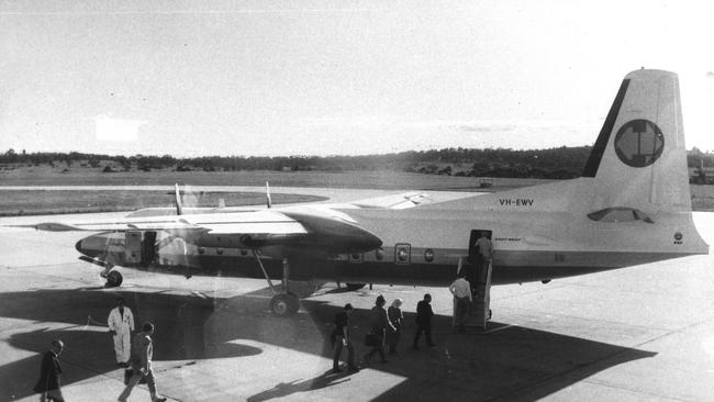 Passengers walk on the tarmac to board an East-West Airlines plane at Tullamarine Airport in 1983.