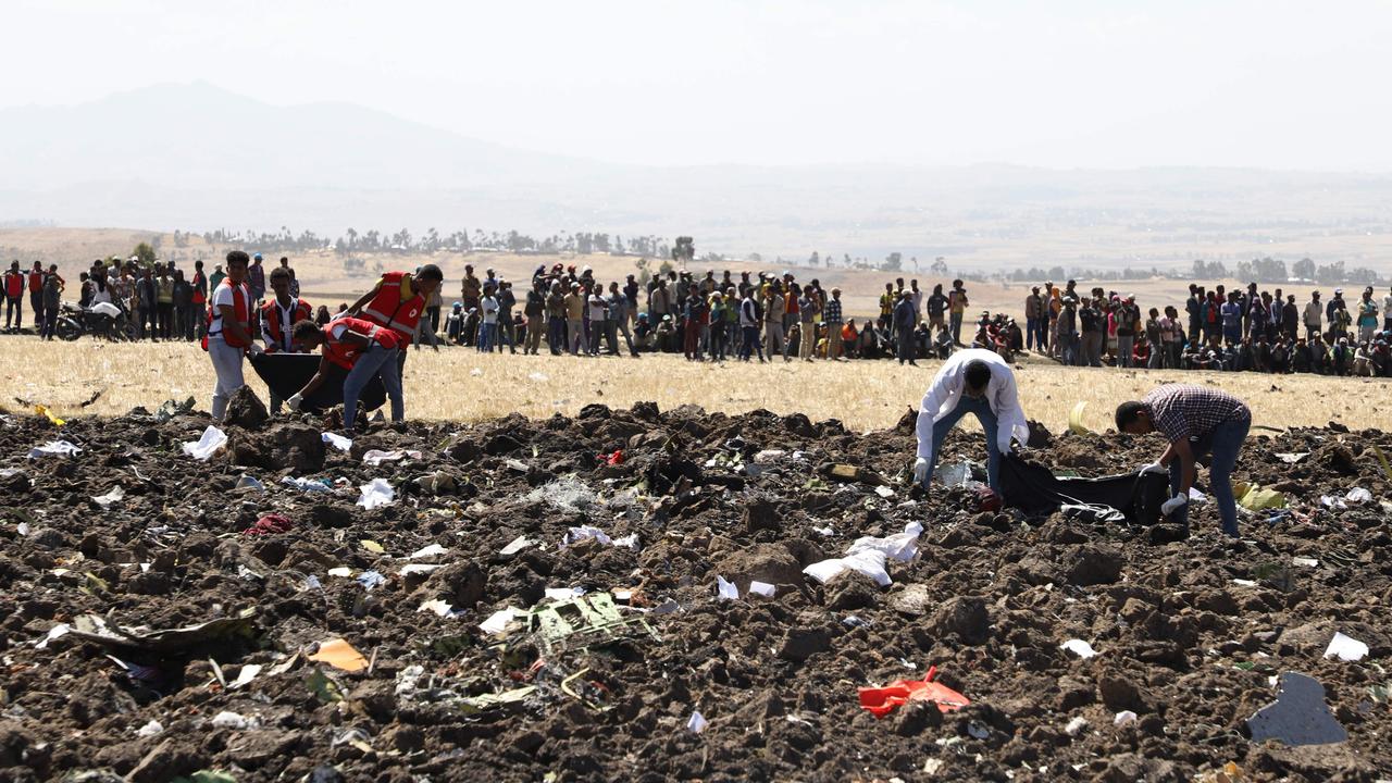 Rescue team collect remains of bodies amid debris at the crash site of Ethiopia Airlines, southeast of Addis Ababa, Ethiopia, on March 10, 2019. Photo AFP