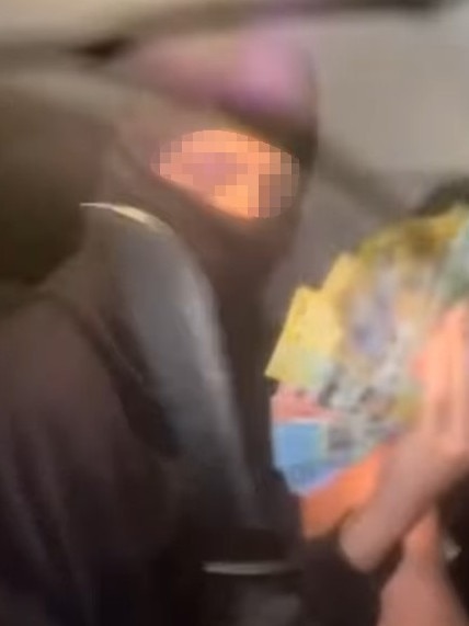 Kid with huge knife flashes cash in a stolen car on Instagram. Picture: Supplied