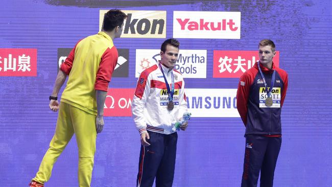 Sun Yang confronted Duncan Scott (R) on the podium. Picture: AP