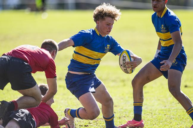 Myles Rosemond of Toowoomba Grammar School 1st XV avoids a tackle from George Hales of St Joseph's College, Gregory Terrace 1st XV in Round 6 GPS Queensland Rugby at TGS Old Boys Oval, Saturday, August 17, 2024. Picture: Kevin Farmer