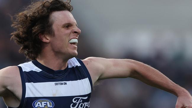 GEELONG, AUSTRALIA - MAY 06: Max Holmes of the Cats celebrates after scoring a goal during the round eight AFL match between Geelong Cats and Adelaide Crows at GMHBA Stadium, on May 06, 2023, in Geelong, Australia. (Photo by Robert Cianflone/Getty Images)