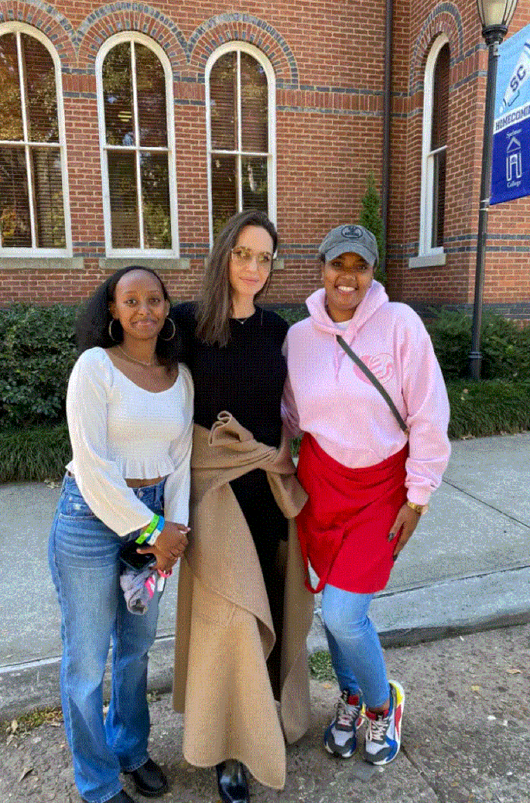 Jolie was happy to pose for photos with her daughter and other students.