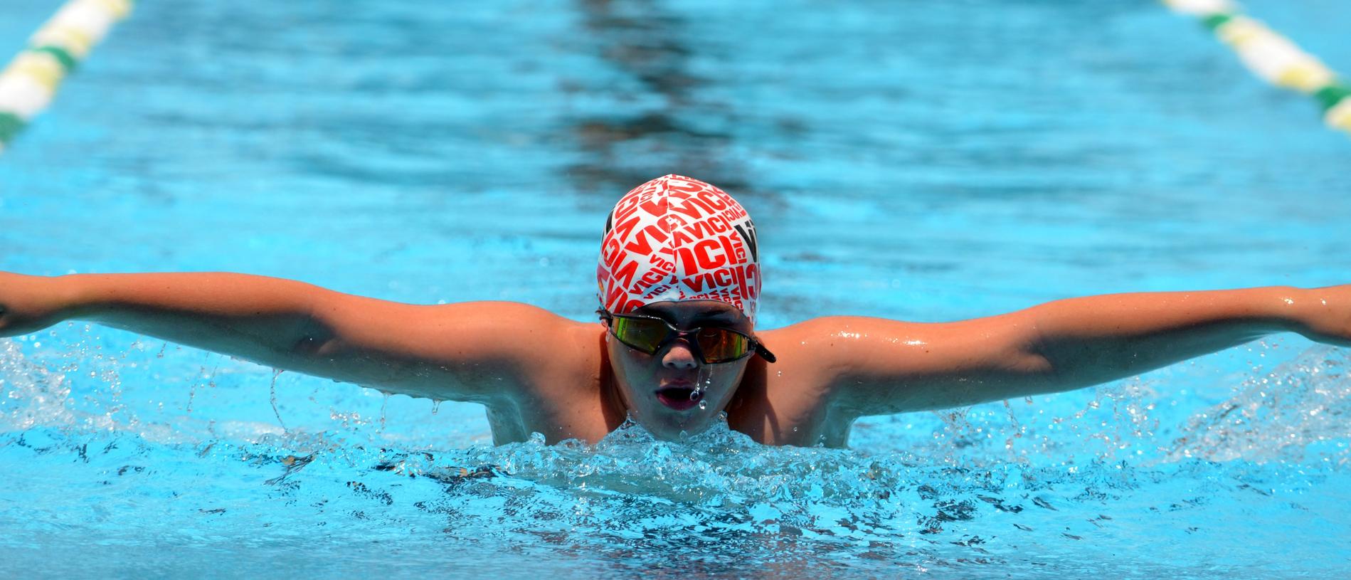 Kaiden Ratcliff swims the butterfly at Burnett State College 2019 swim carnival.