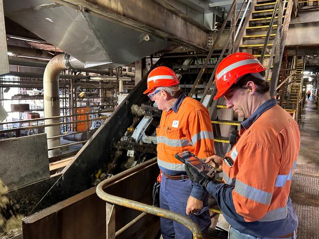 Kalamia Mill Senior Production Technologist Colin McLean and Manager Operations Andrew Wallwork carry out checks for the start of production at Kalamia Mill. The first bin has been tipped at Wilmar Sugar and Renewables Kalamia Mill in the Burdekin, North Queensland, for the 2024 crush season. Picture: Supplied