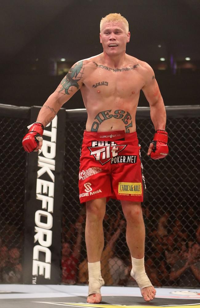 PHOENIX - AUGUST 13: Joe Riggs celebrates after defeating Louis Taylor (not pictured) in the Strikeforce Challengers Men's Main card bout at Dodge Theater on August 13, 2010 in Phoenix, Arizona. (Photo by Christian Petersen/Getty Images)