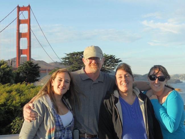 Damien Meins, 58, is seen standing with his family in San Francisco in a photo posted on his Facebook page. Picture: Facebook.