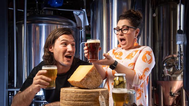 RAISE A GLASS: Senior cheesemaker Mitchell Lloyd from Woodside Cheese Wrights and Cara Pearson-Huijsse from Sparkke gear up for Cheesefest+FERMENT this weekend. Picture: Brad Fleet