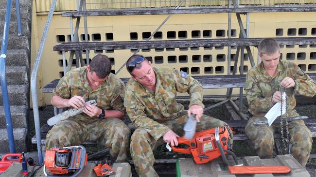 Ten anniversary of Cyclone Yasi.Severe Cyclone Yasi 2011. Privates' Patrick Gilmore, Brett Fitzgerald and Pavel Elseev service chainsaws at Tully Showgrounds. Picture: Evan Morgan