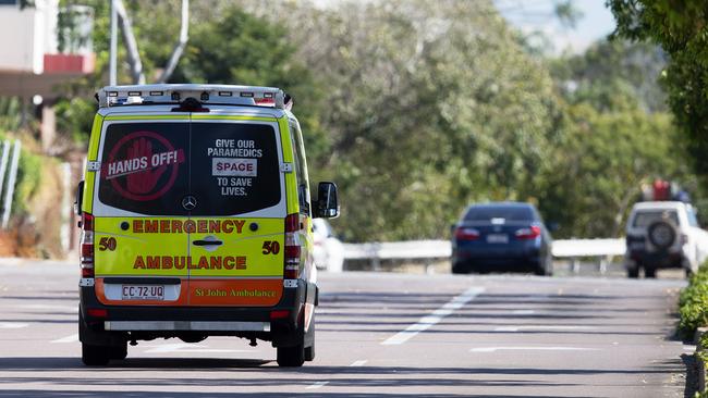 A woman has been arrested for allegedly spitting in the face of an ambulance worker coming to her aid.