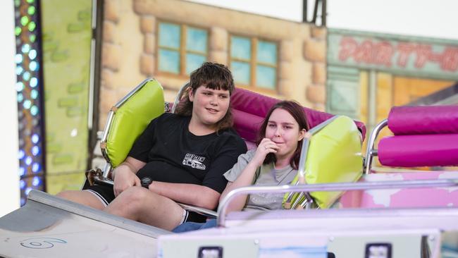 Siblings Jayden and Ally Halter ride the Cyber Dance Cafe at the Toowoomba Royal Show, Thursday, March 30, 2023. Picture: Kevin Farmer