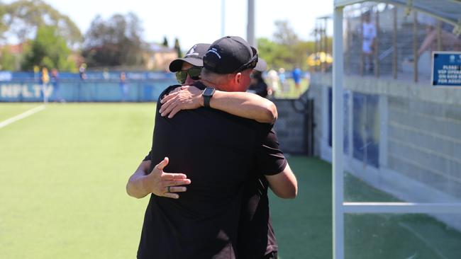 Hugs for a job well done. Balgownie JFC coaches after Champion of Champions victory. Picture: Daniel Rowen | Balgownie JFC