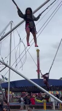 Having a ball jumping on trampoline.