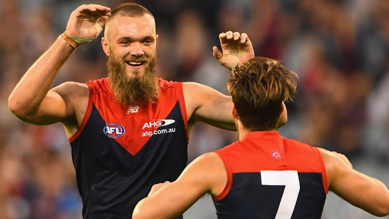 MELBOURNE, AUSTRALIA - APRIL 17: Max Gawn of the Demons is congratulated by Jack Viney after kicking a goal during the round four AFL match between the Collingwood Magpies and the Melbourne Demons at Melbourne Cricket Ground on April 17, 2016 in Melbourne, Australia. (Photo by Quinn Rooney/Getty Images)