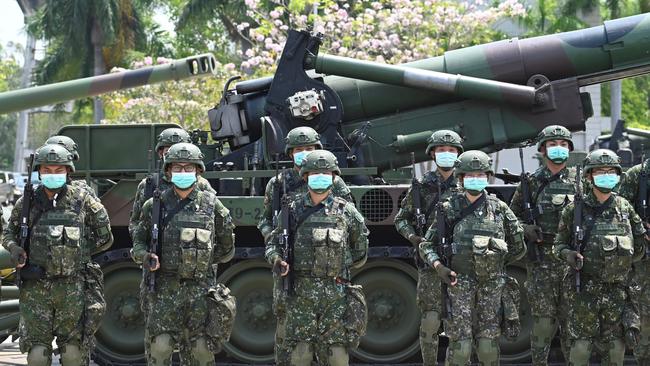 Soldiers stand in formation in front of a US-made M110A2 self-propelled howitzer during Taiwan President Tsai Ing-wen's visit to a military base in Tainan last year. Picture: AFP