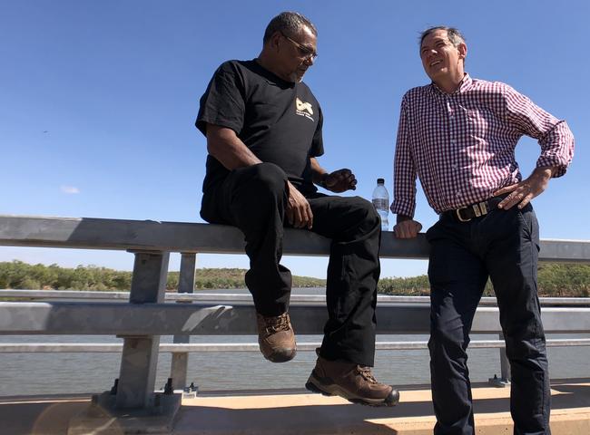 Northern Land Council chairman Samuel Bush-Blanasi and Chief Minister Michael Gunner discussed fishing permits at a bridge overlooking the Victoria River in Timber Creek.