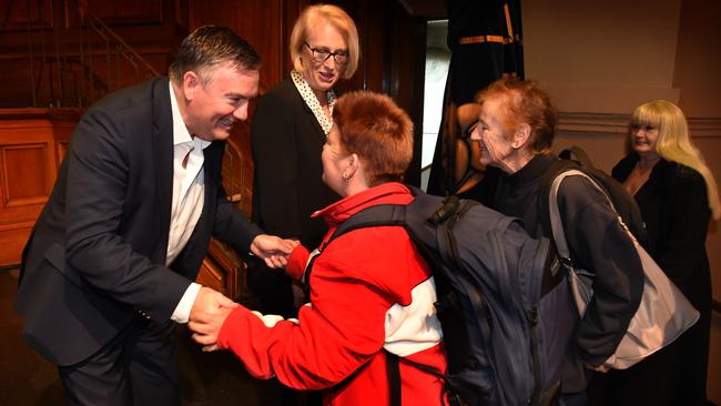 McGuire meets with some homeless people in 2014. Picture: Tony Gough