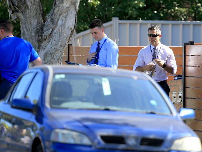 Detectives at the scene on Monday afternoon after a child was found in a car. Picture: Mark Stewart