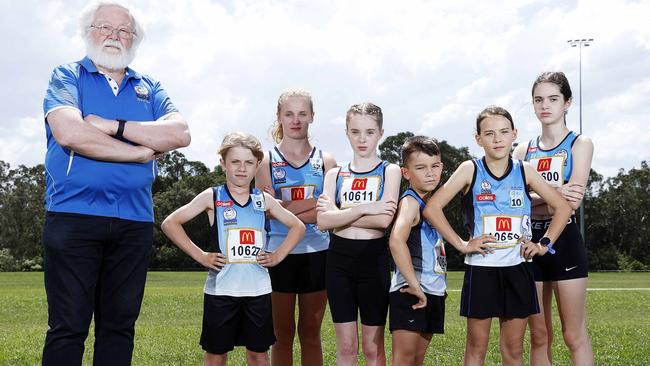 DAILY TELEGRAPH - Pictured in Rouse Hill today is President of Rouse Hill Rams Little Athletics Bob Gribbin with kids (L-R) Zane Cowper 9, Flynn Cowper 12, Ella Caines 10, Oliver White 8, Evelyn White 10, and Lily Caines 12, who aren't able to return to the sporting field until December. Picture: Tim Hunter.
