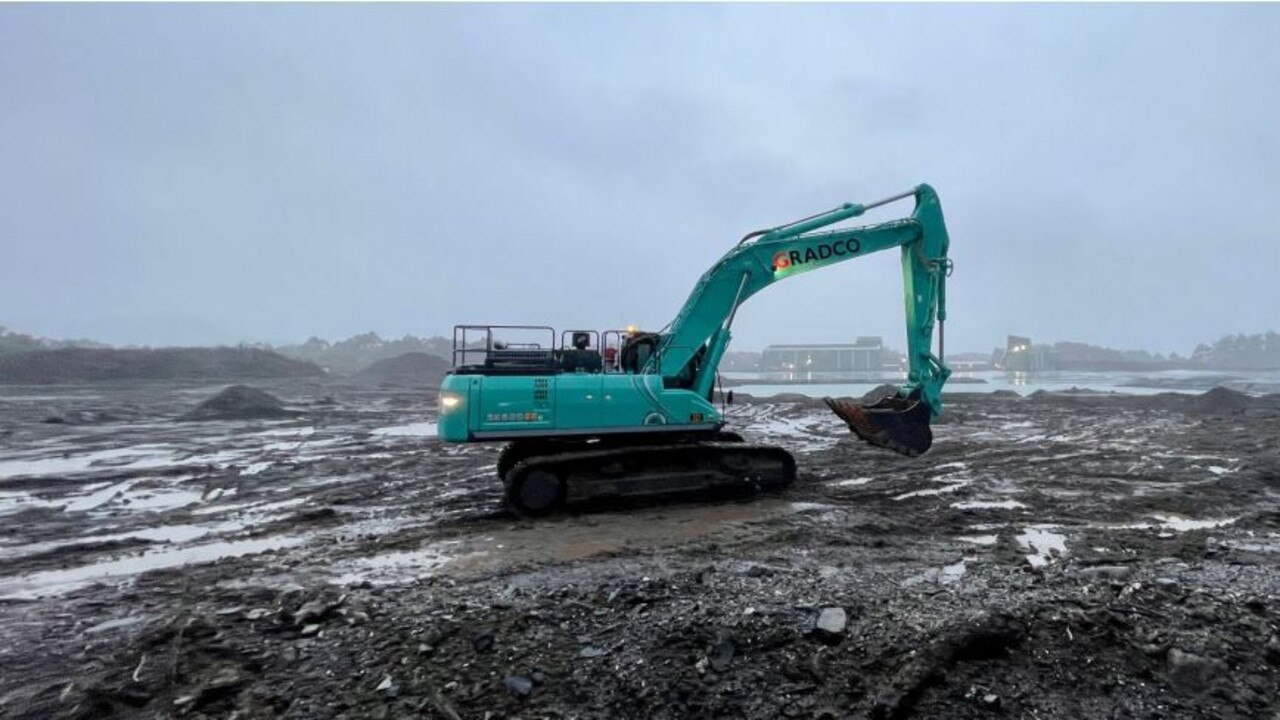 Excavator at the quarry site within the future Avebury tailings dam footprint, with the processing plants visible in the background. Picture: Mallee Resources