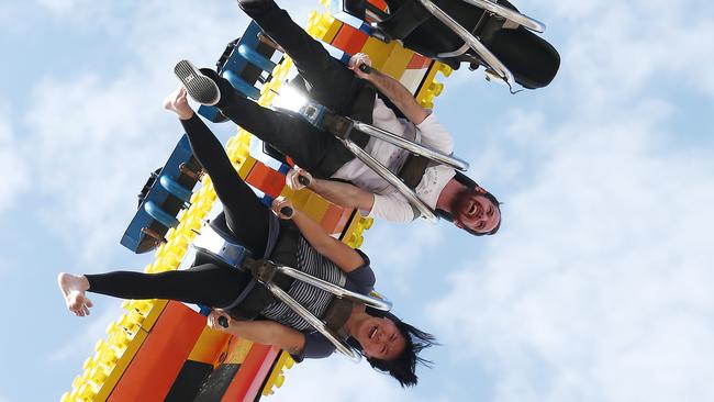 Olivia Ouyang and Dylan Carmody hang out on the March's Skywalker ride in sideshow alley. PICTURE: BRENDAN RADKE