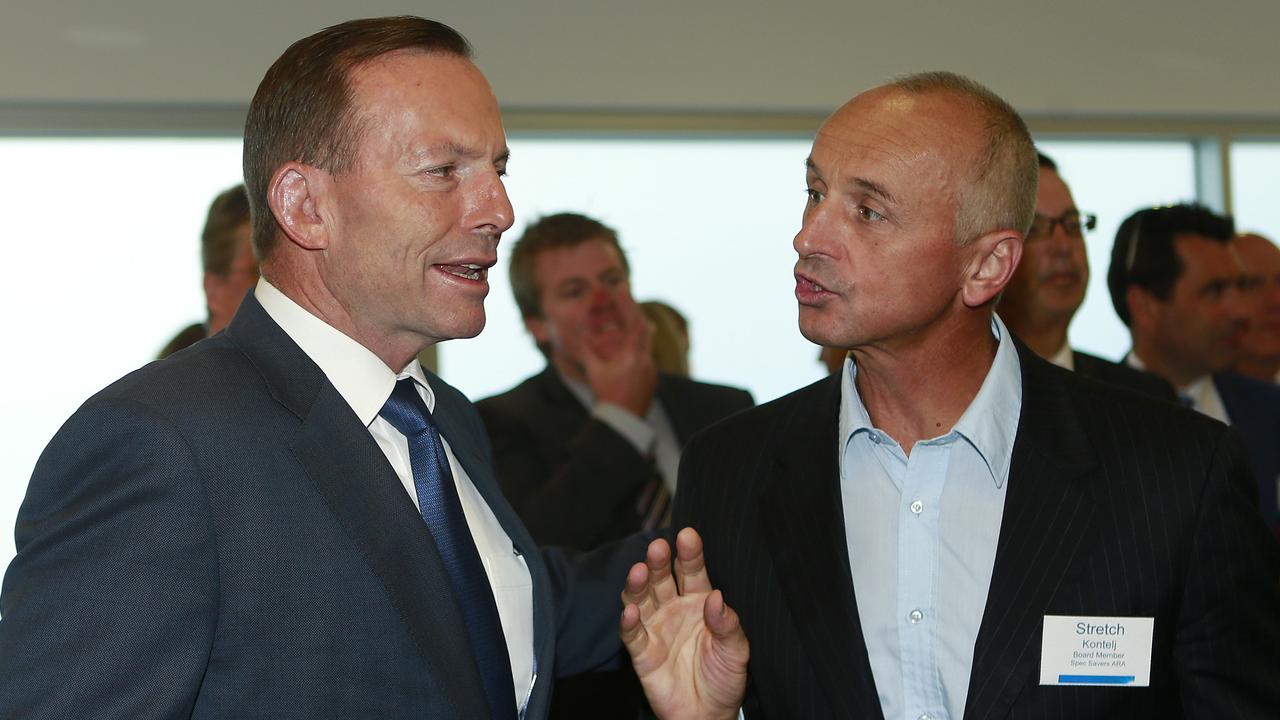 Long-serving councillor Stretch Kontelj, pictured here with former prime minister Tony Abbott, wants to return to City Hall. Picture: Alison Wynd.