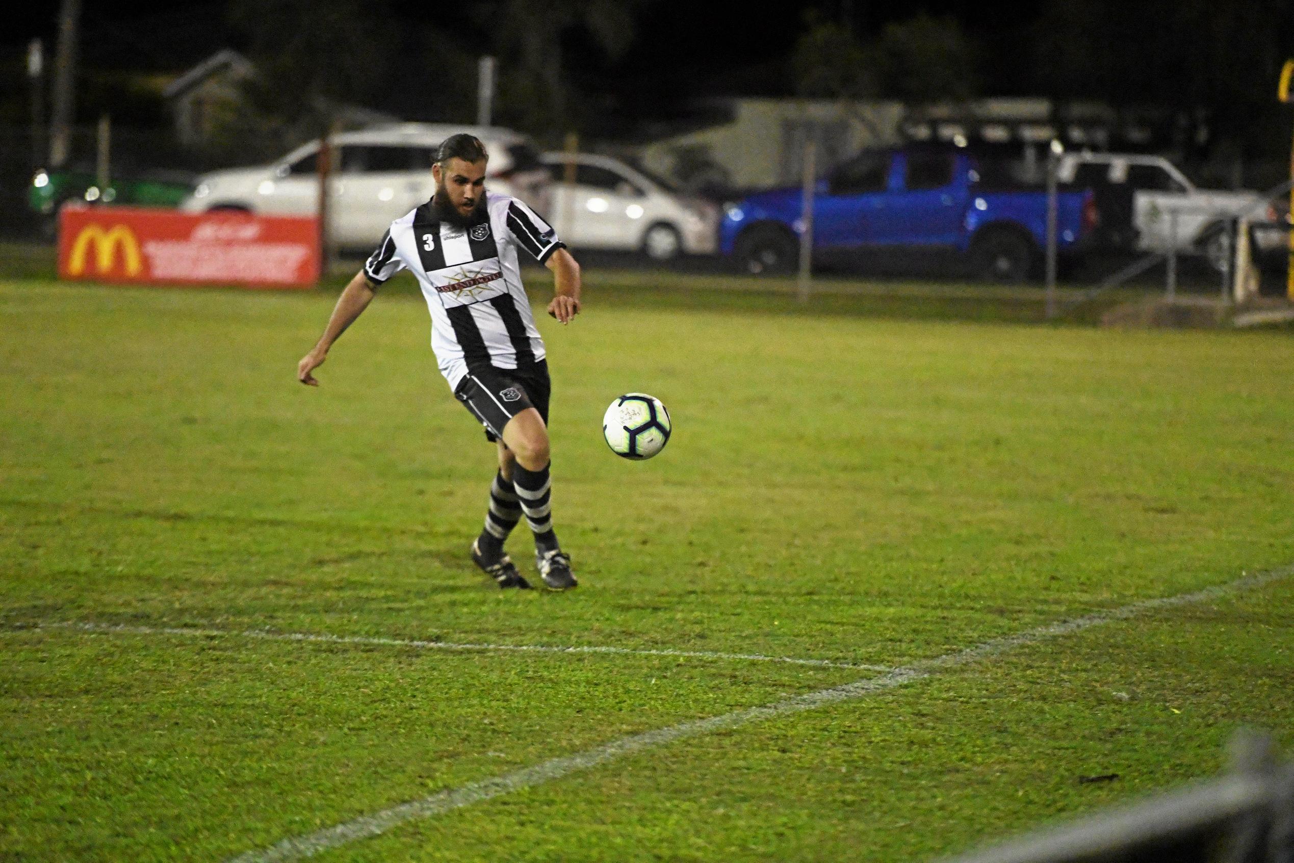 Bingera's Robert Cull boots the ball. Picture: Shane Jones