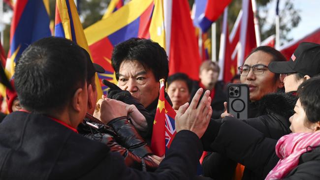 Police and protesters faced off Monday on the lawns of Parliament House ahead of Chinese Premier Li Qiang’s visit. Picture: NewsWire / Martin Ollman