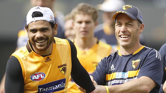 Alastair Clarkson and Cyril Rioli. Picture: Yuri Kouzmin