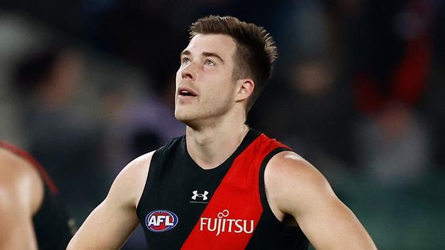 MELBOURNE, AUSTRALIA - AUGUST 10: Zach Merrett of the Bombers looks dejected after a loss during the 2024 AFL Round 22 match between the Essendon Bombers and the Gold Coast SUNS at Marvel Stadium on August 10, 2024 in Melbourne, Australia. (Photo by Michael Willson/AFL Photos via Getty Images)