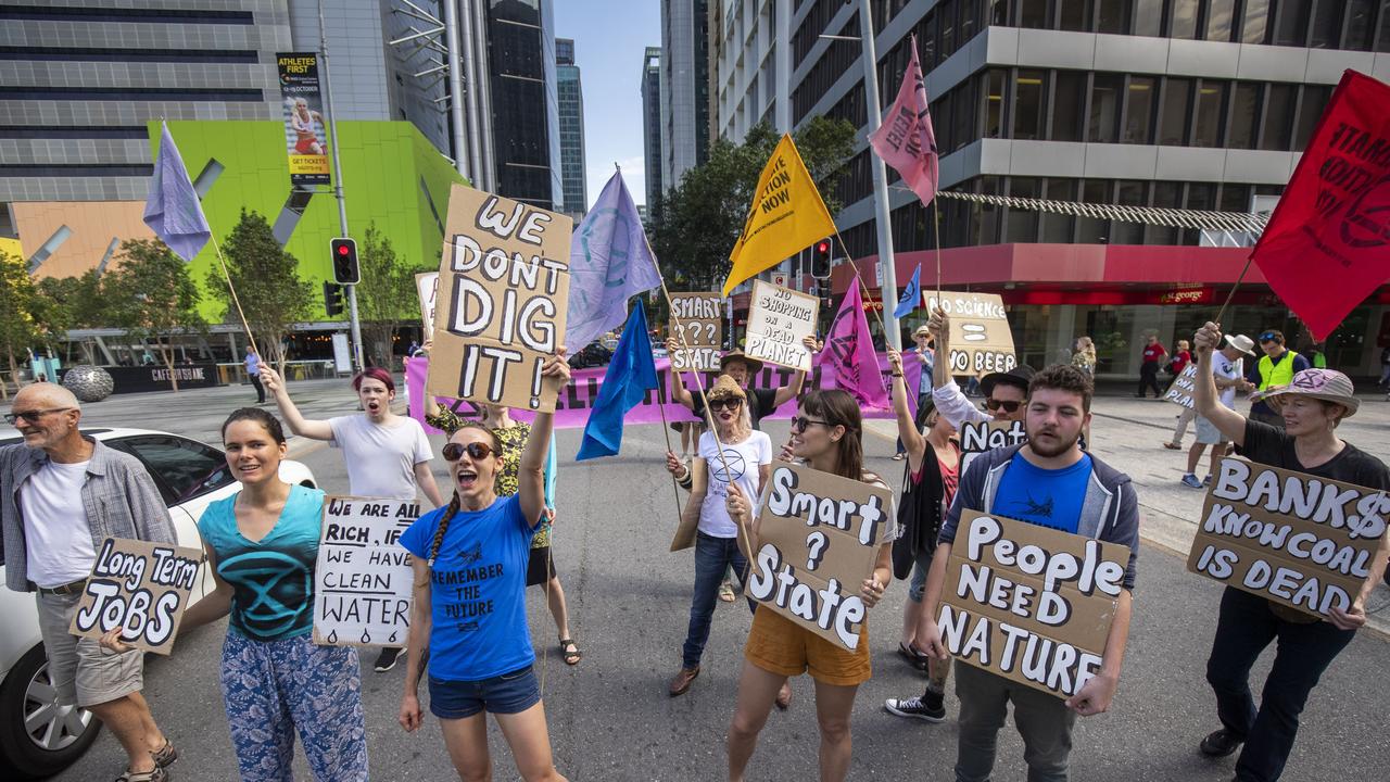 Activists from Extinction Rebellion participate in a protest in Brisbane on Tuesday. Picture: AAP Image/Glenn Hunt