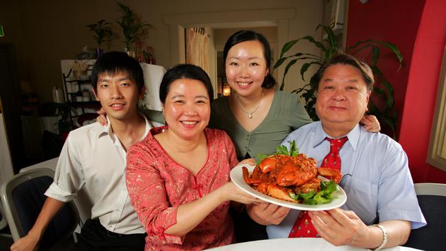 Owners Harry Lau and his wife Shaomin, of Harry's Singapore Restaurant, with a plate of Chilli crab at their Elizabeth street restaurant in Sydney.