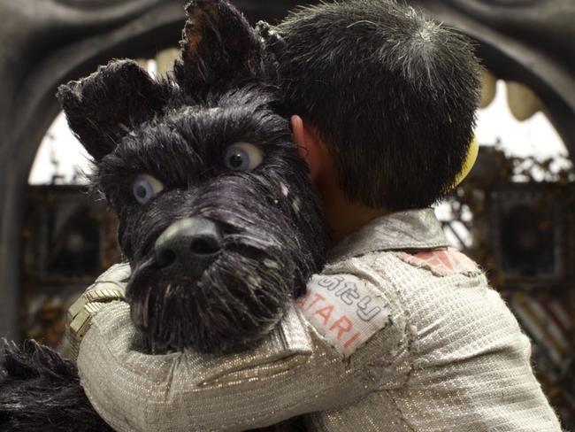 Chief, voiced by Bryan Cranston gets a hug in Isle of Dogs. Picture: Fox Searchlight via AP