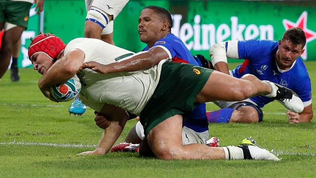 South Africa's number 8 Schalk Brits (L) scores a try against Namibia. Picture: AFP