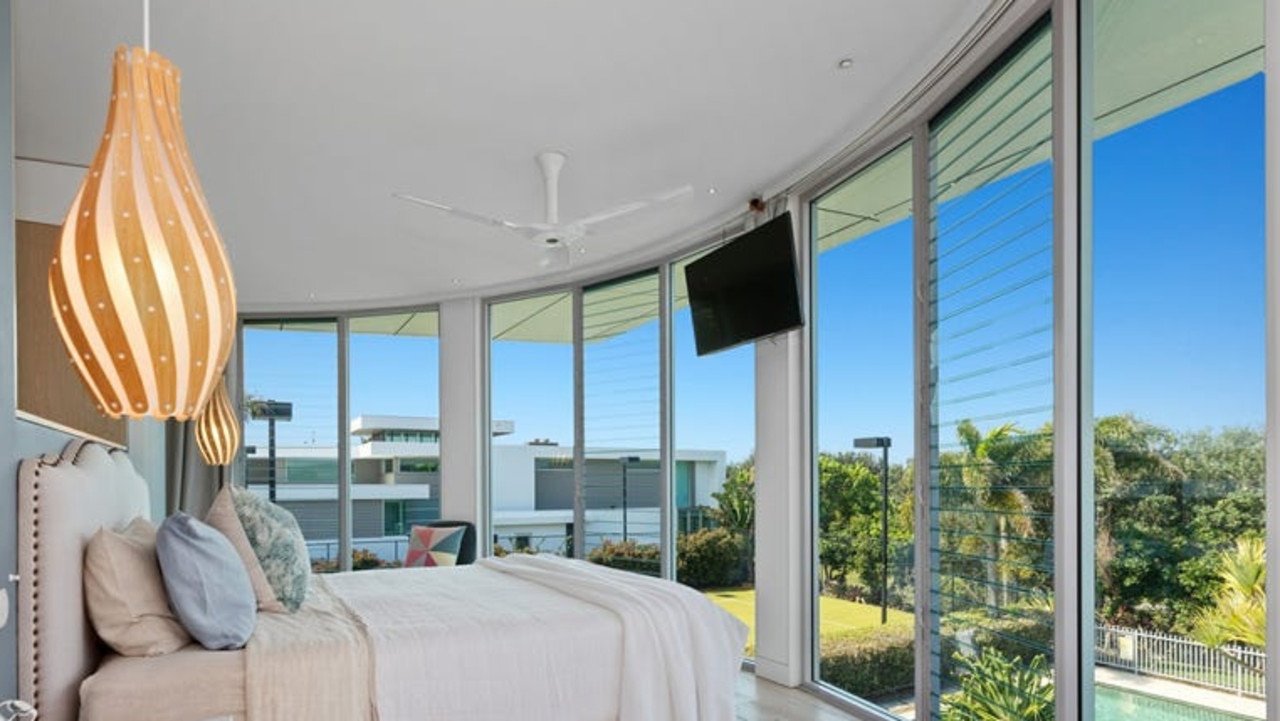 A lavish master bedroom retreat is set over two levels