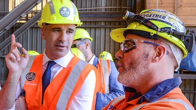 Premier Peter Malinauskas and Federal Minister Ed Husic talk to steel worker Matt Rogers after announcing the Whyalla steel plant will be run on hydrogen fuel, making it the first green steel plant in the world. April 4, 2023. Picture: GFG ALLIANCE/Brenton Edwards