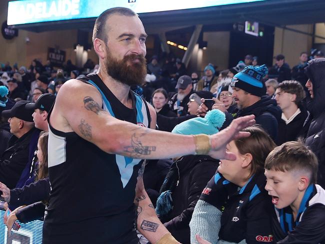 ADELAIDE, AUSTRALIA – JULY 20: Charlie Dixon of the Power with fans after the win during the 2024 AFL Round 19 match between the Port Adelaide Power and the Richmond Tigers at Adelaide Oval on July 20, 2024 in Adelaide, Australia. (Photo by Sarah Reed/AFL Photos via Getty Images)