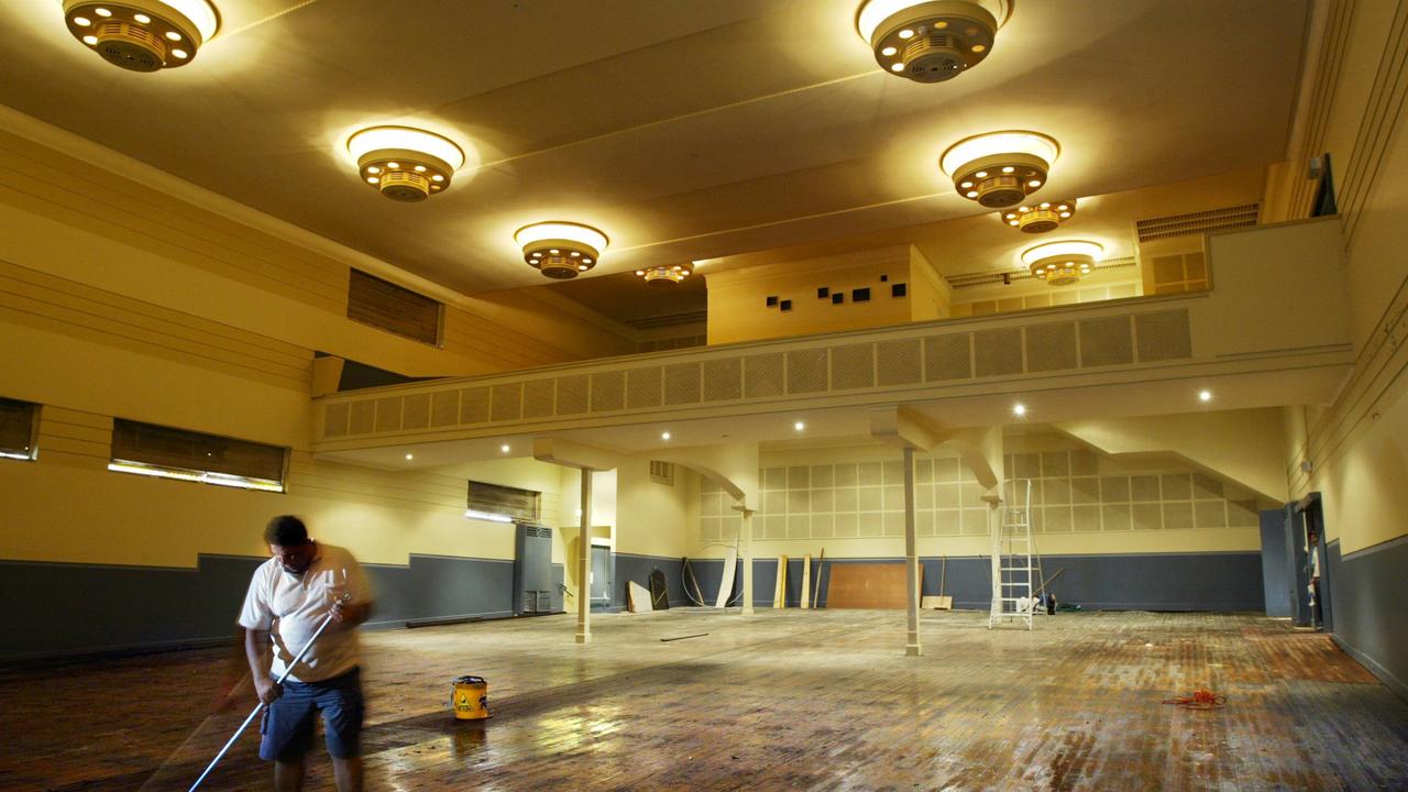 Worker Abdel Danial mops the floors of The Hub Theatre at Newtown in Sydney, when it was being refurbished in 2014 as a venue for the Cracker Comedy Festival.