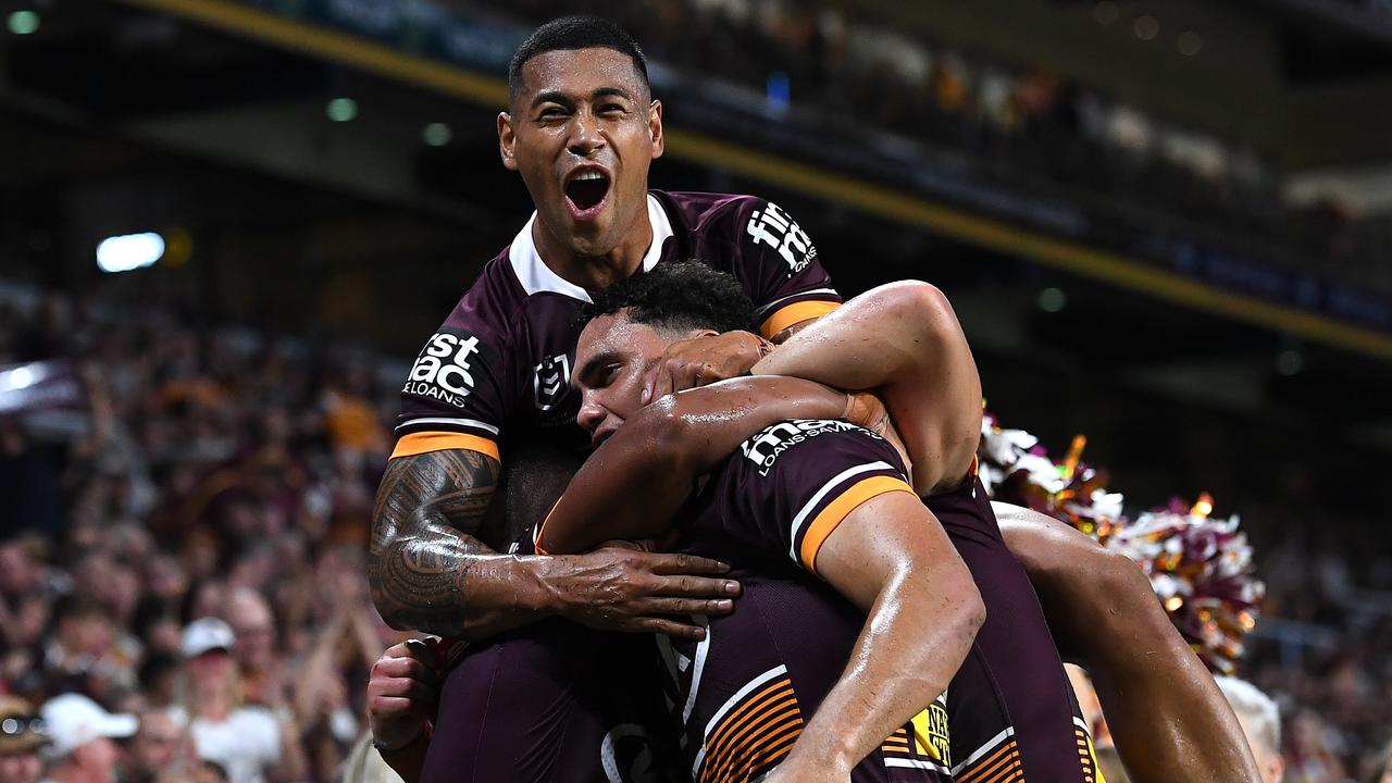 Xavier Coates of the Broncos celebrates with Jamayne Isaako.