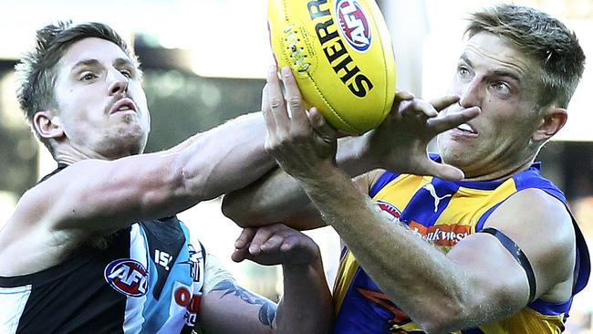 Port Adelaide’s Hamish Hartlett battles against West Coast’s Brad Sheppard. Picture Sarah Reed