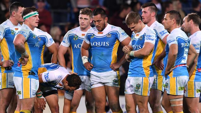 Titans players look on after a Broncos try last week.