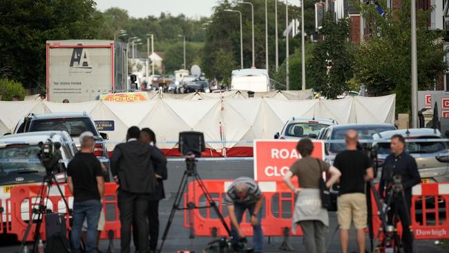 The media gather near the scene of the multiple stabbing attack. Picture: Getty Images.