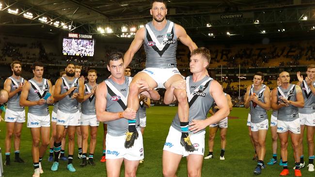 RE-SIGNED: Former Port Adelaide captain Travis Boak, who has triggered a one-year contract extension for next season, is chaired off after his 250th game against Collingwood last Friday. Picture: MICHAEL WILSON (AFL Photos).