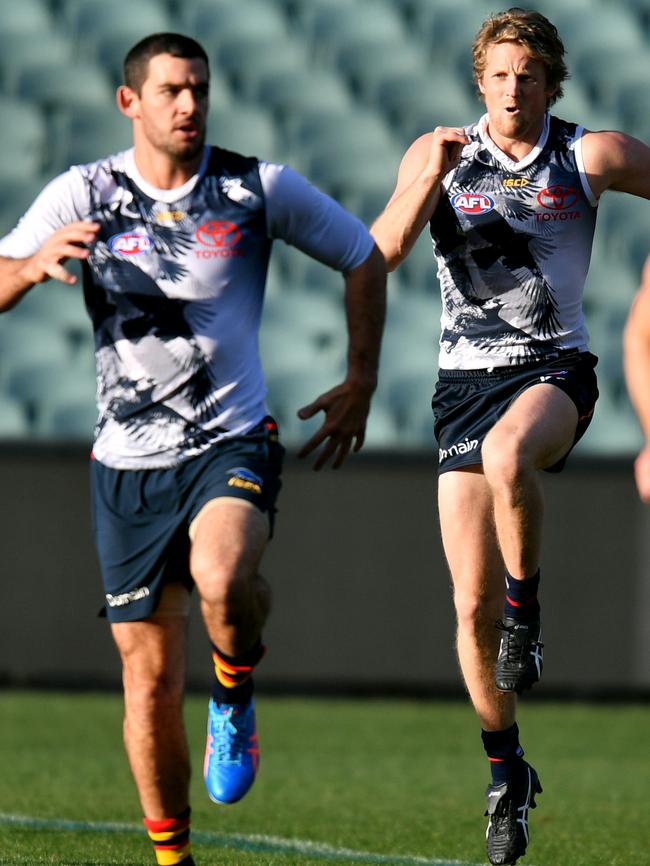 Adelaide’s Taylor Walker and Rory Sloane train on Wednesday. Picture: AAP Image/Kelly Barnes